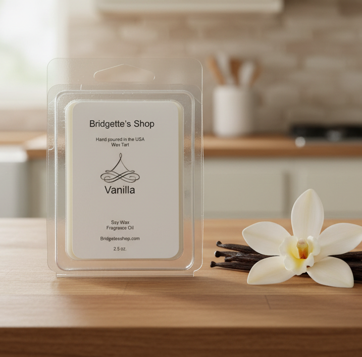 Vanilla wax melt package with vanilla beans and a flower on a kitchen counter