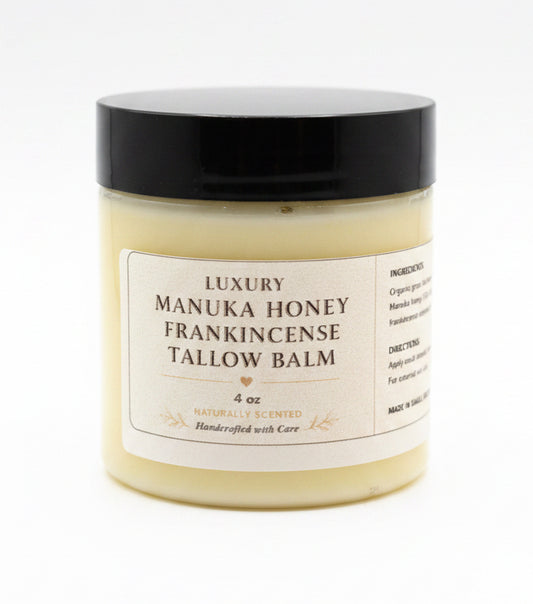 Manuka Honey Frankincense Tallow Balm jar with black lid on a white background