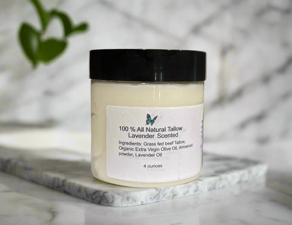 Jar of 100% all natural tallow candle with lavender scent on a white doily against a wooden background.