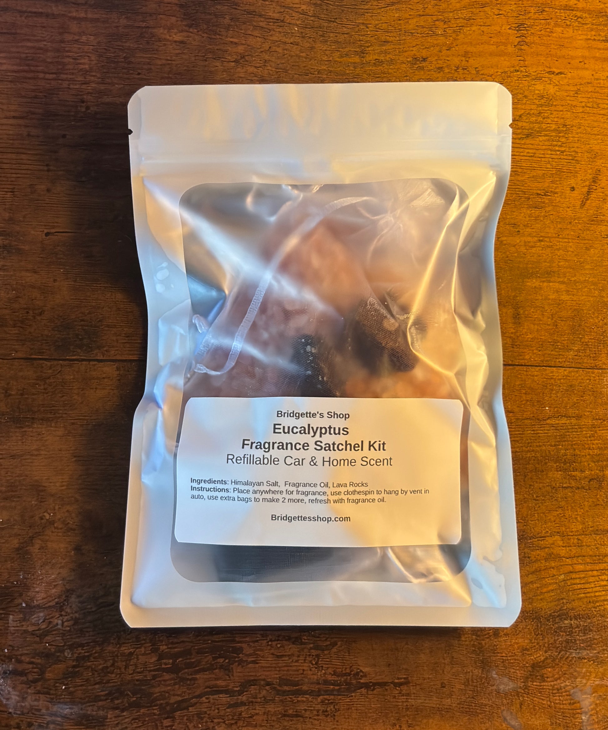 Eucalyptus fragrance satchel kit packaging on a wooden surface