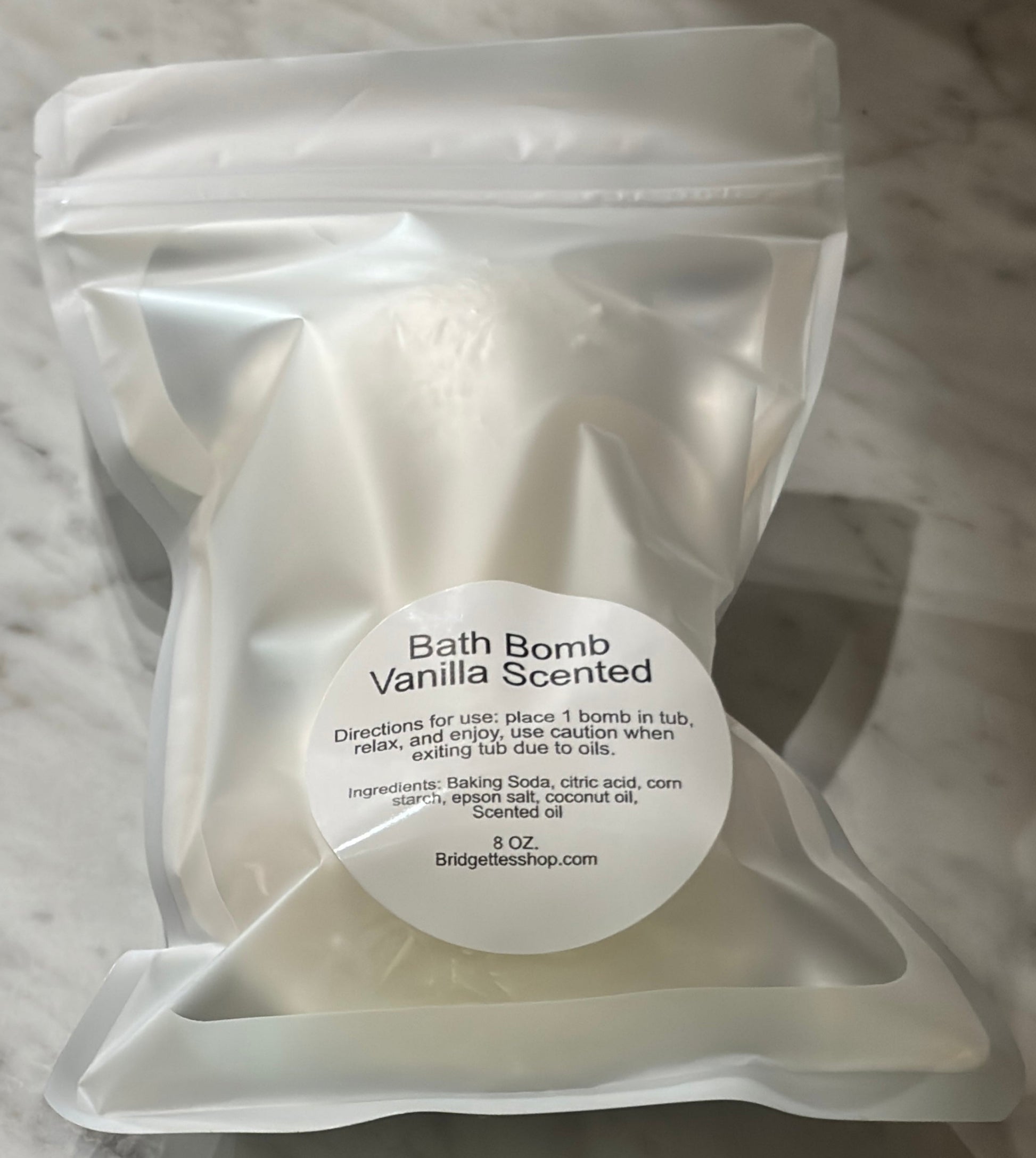 bath bomb vanilla scented in clear packagein