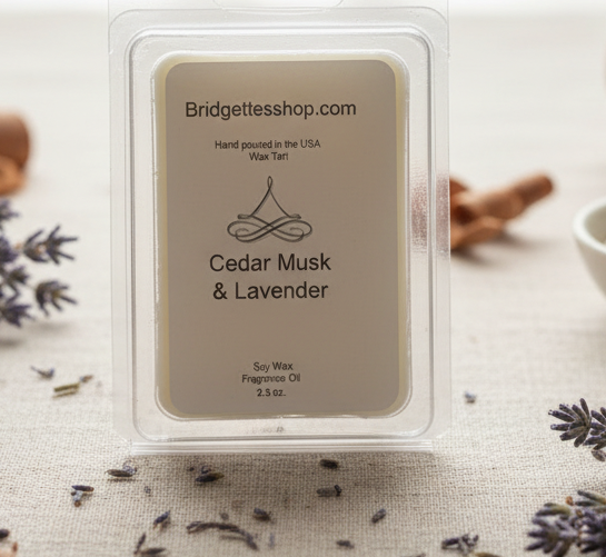 Bridgette's Shop Cedar Musk & Lavender wax melt package on a table with lavender flowers and cinnamon sticks.