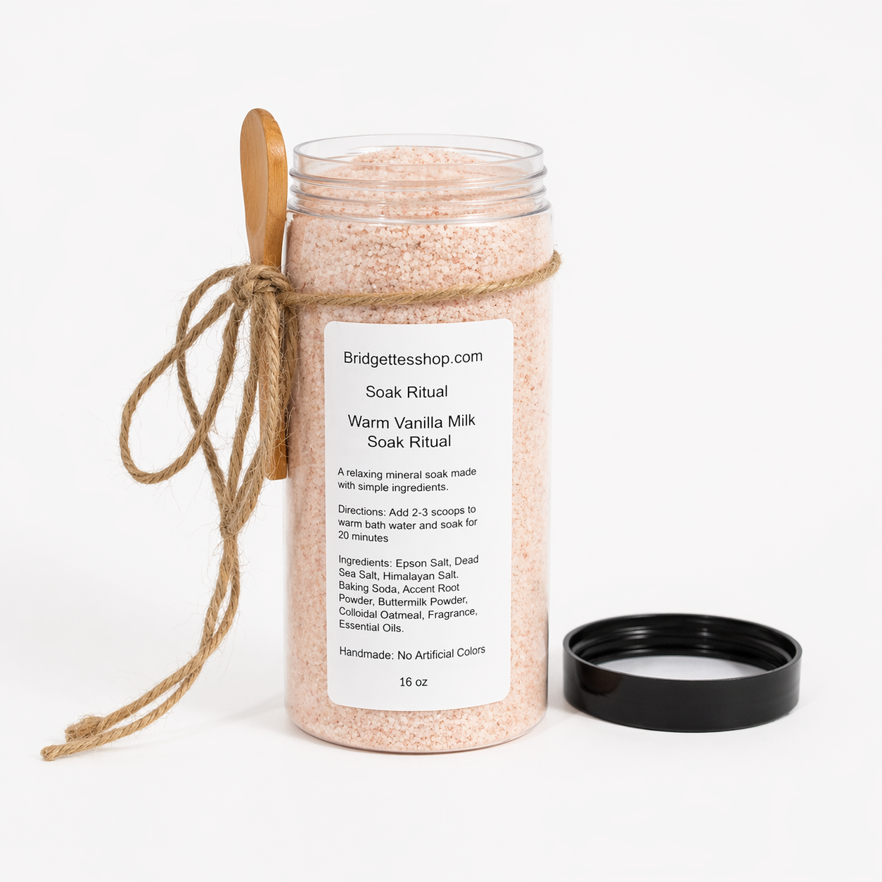 Jar of warm vanilla milk soak ritual with a wooden spoon and label on a white background