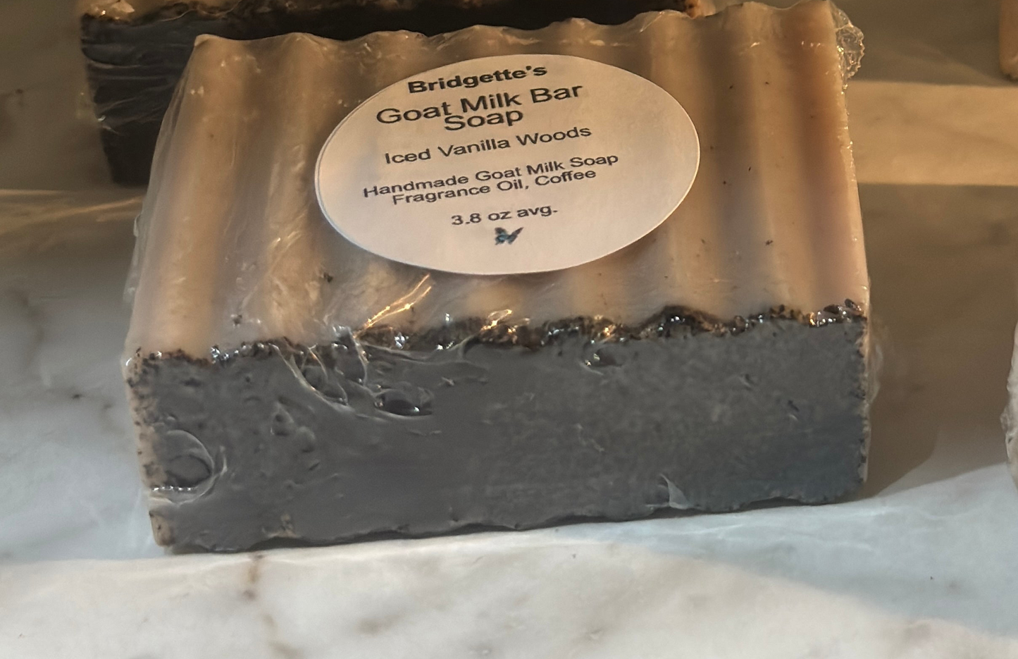 Bar of Bridgette's Goat Milk Bar Soap with a label on a marble surface