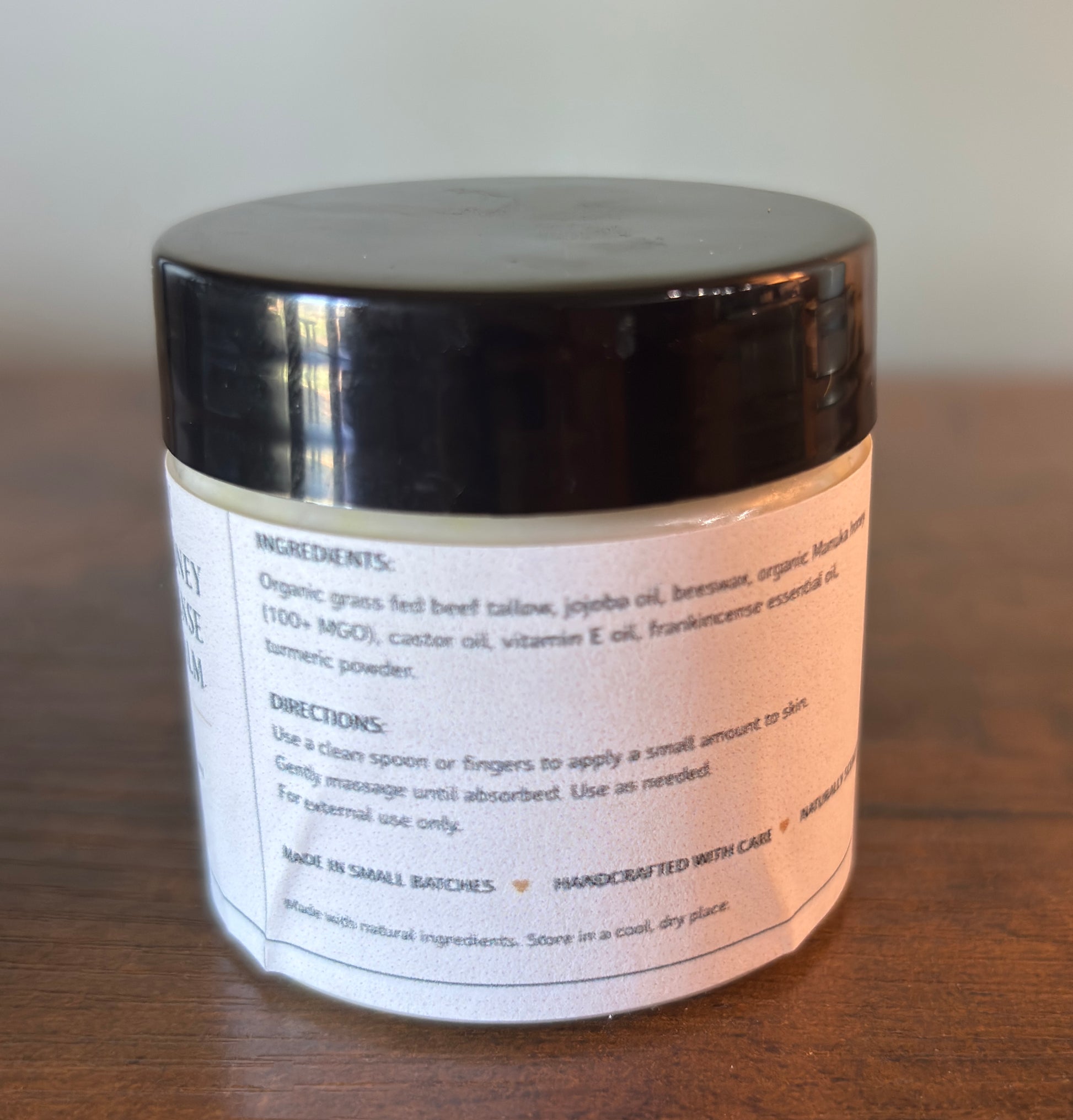 Jar with a label on a wooden surface
