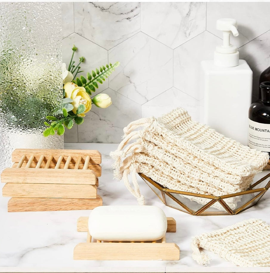 Bathroom setting with soap, loofah, and soap dish on a marble surface.