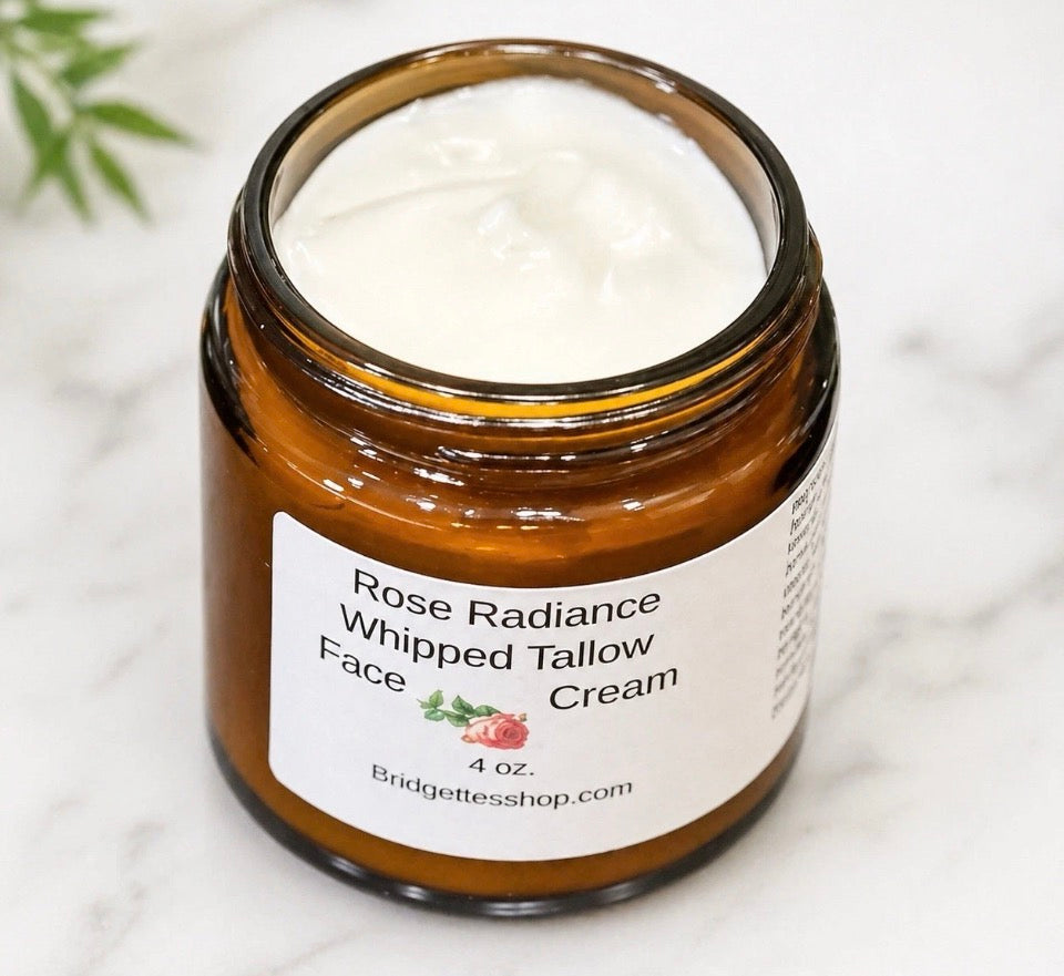 Jar of Rose Radiance Whipped Tallow Face Cream on a marble surface